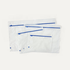 Laydown of The Easy Wash Bag in four different sizes.