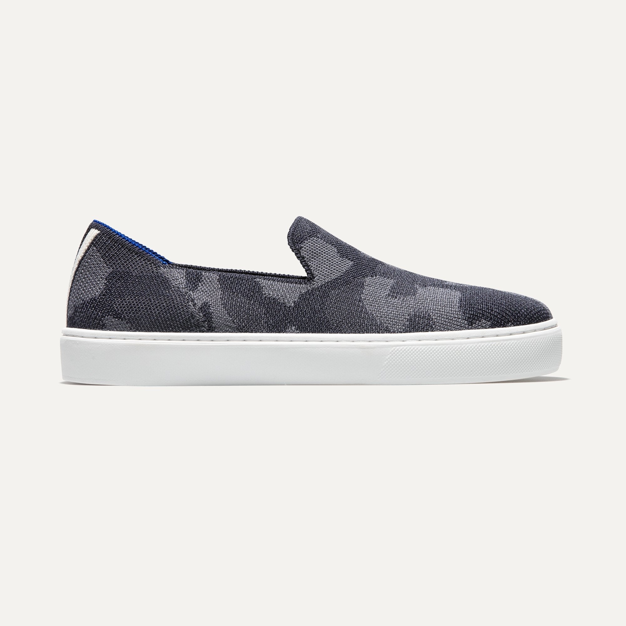 The slip-on Sneaker in Grey Camo shown from a side view showing the outsole.