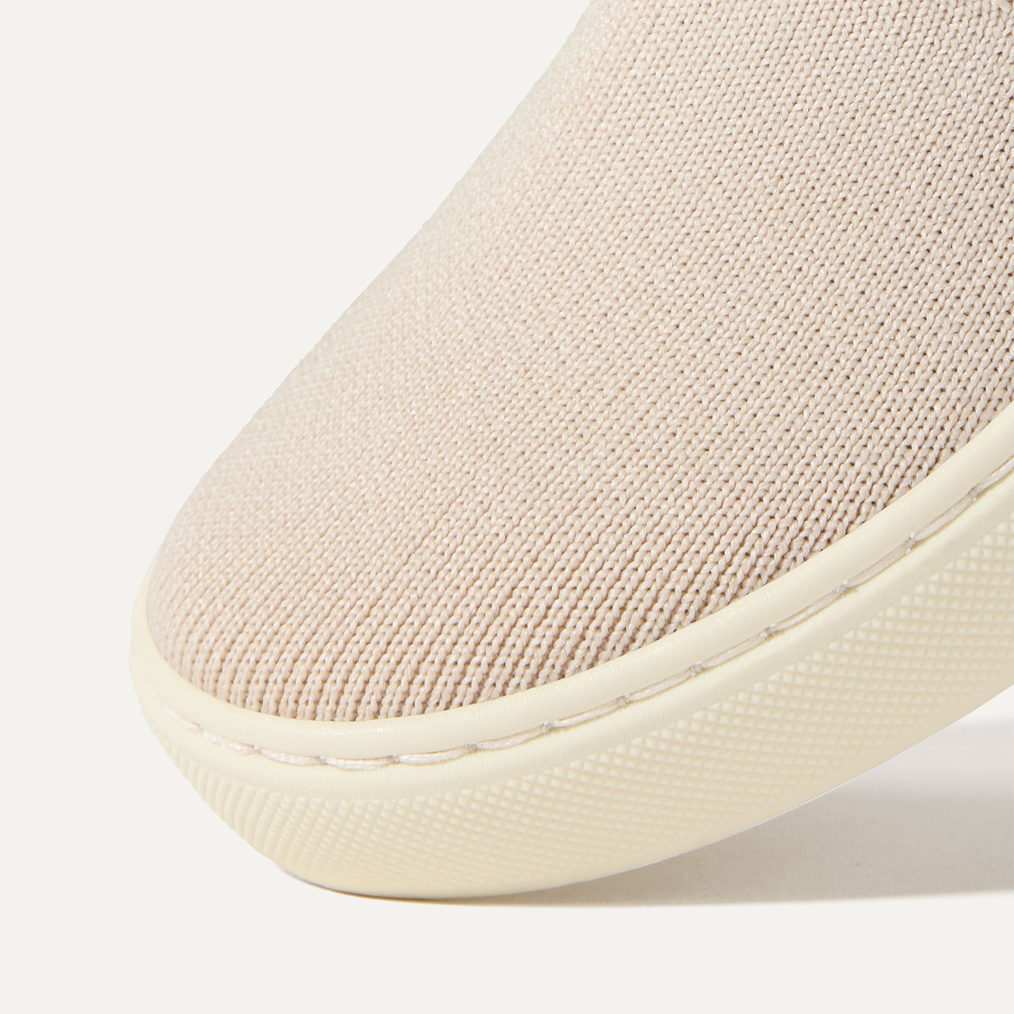 Close up of the toe and vamp of The Kids Sneaker in Sand.