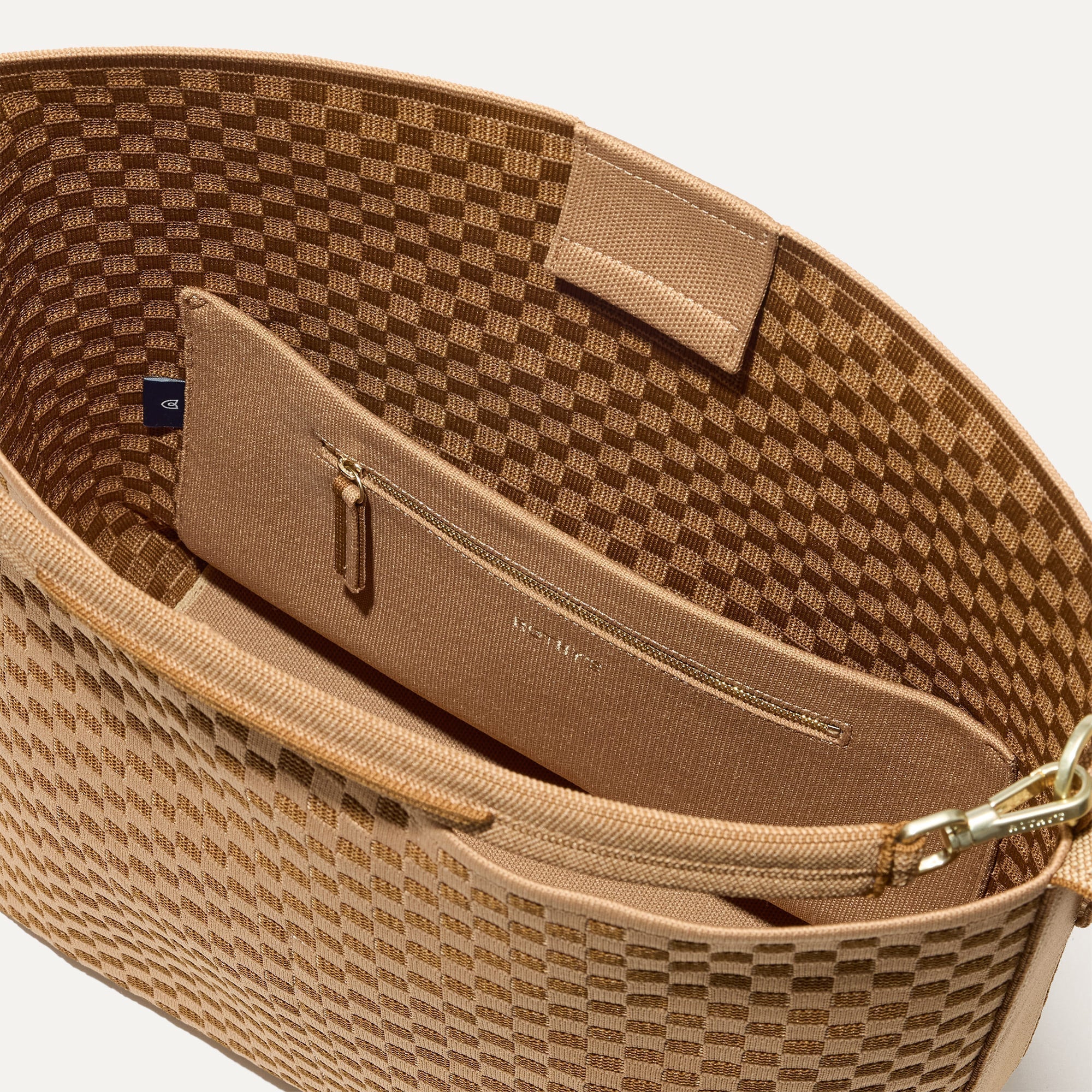 The Bucket Bag in Hazelnut close up of interior zipper pocket.