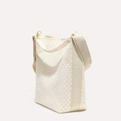 The Bucket Bag in White Sand shown in a diagonal view.
