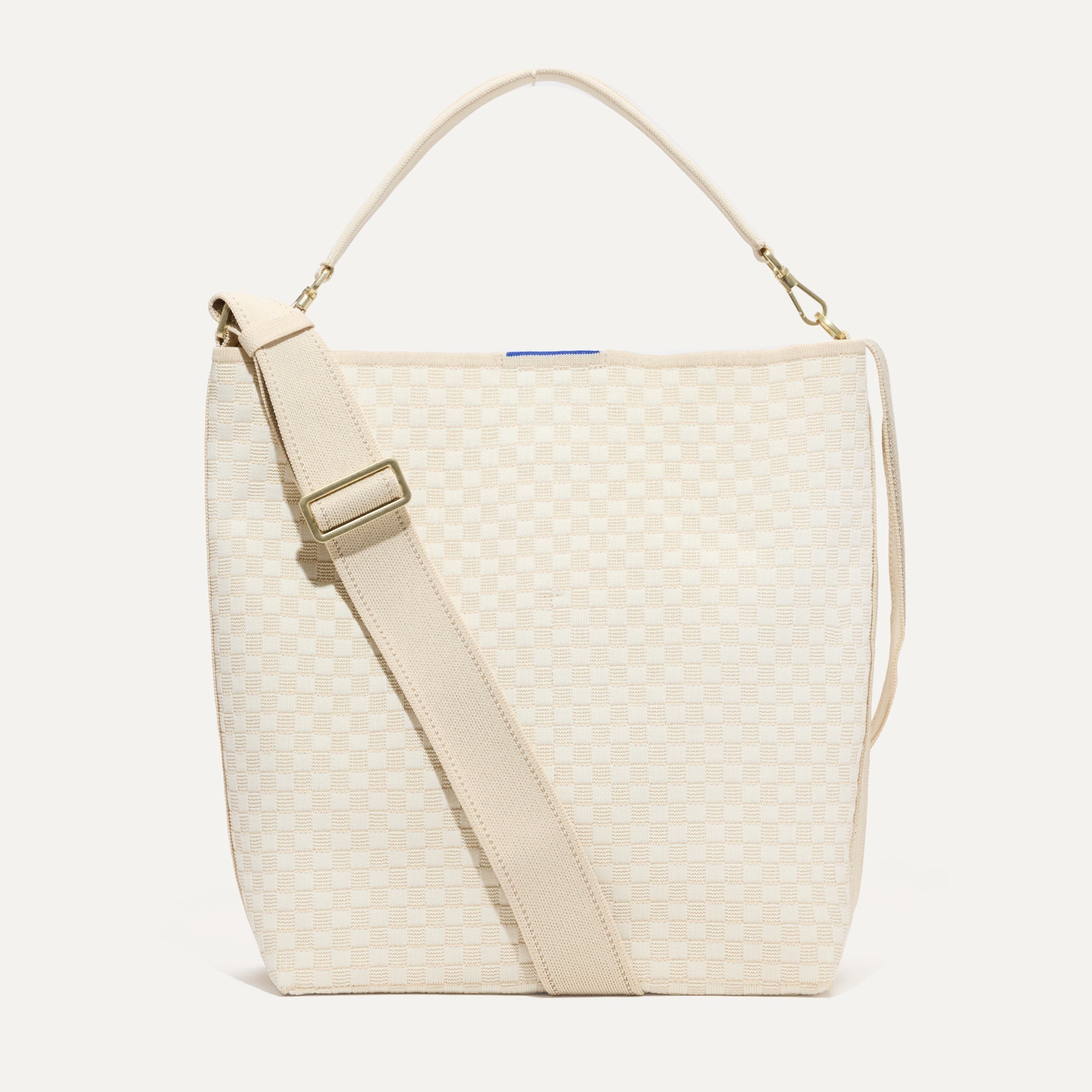 The Bucket Bag in White Sand shown from the front.