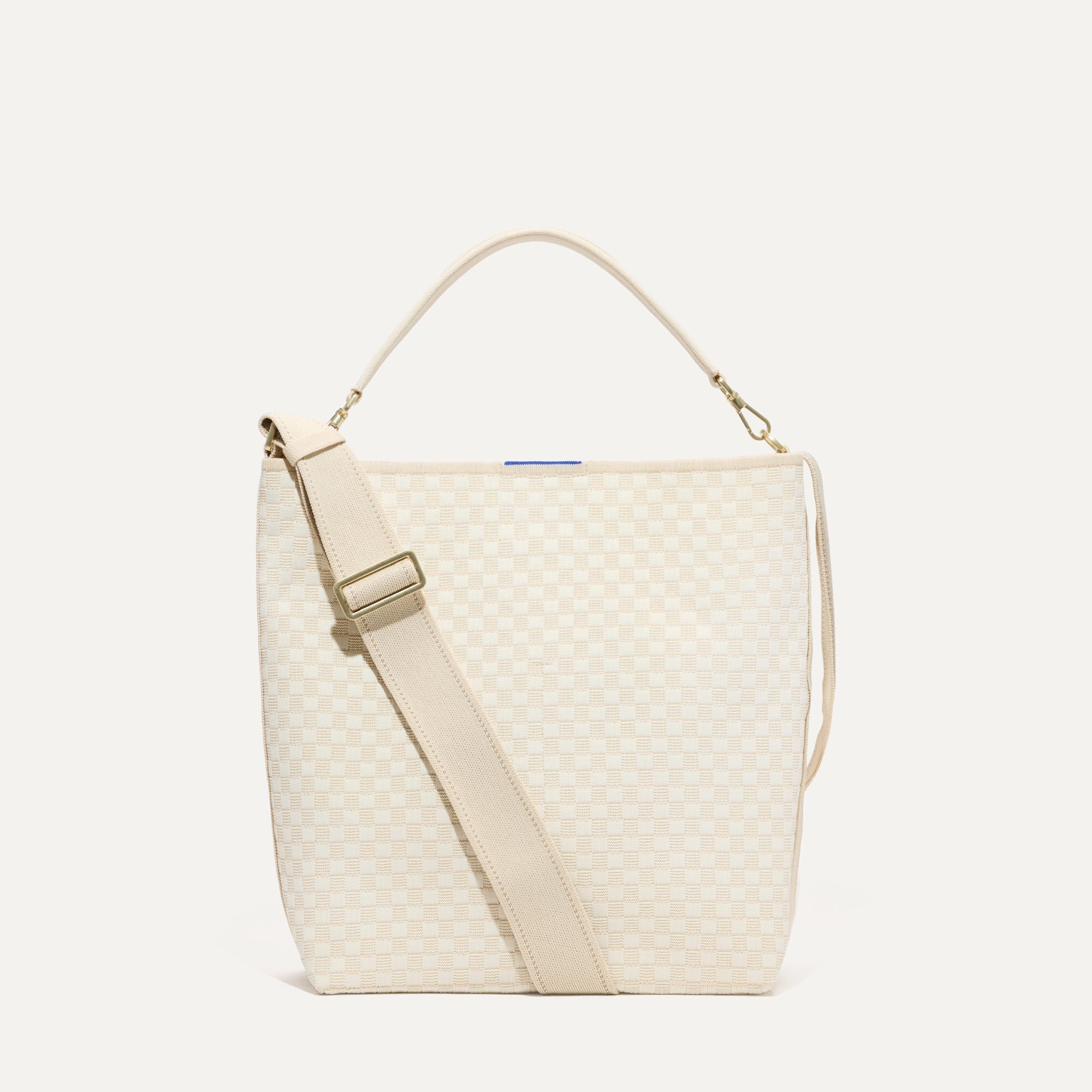 PLP |The Bucket Bag in White Sand shown from the front.