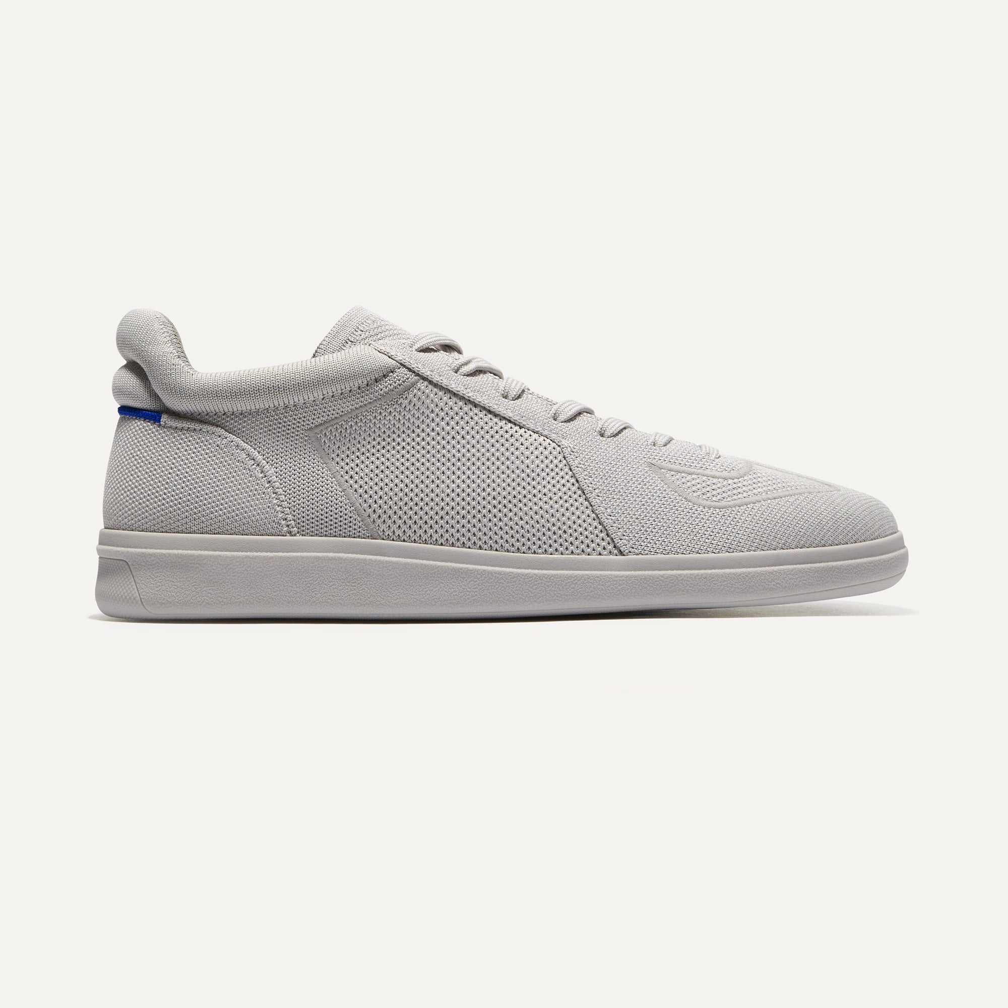 The RS01 Sneaker in Light Grey shown from the side.