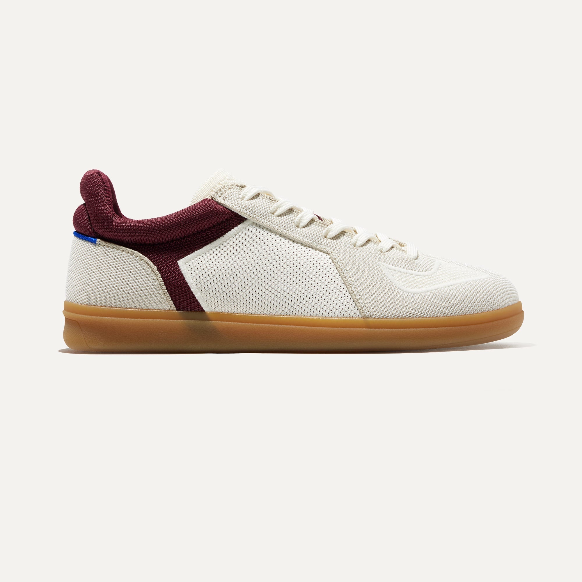 The RS01 Sneaker in Maroon shown from the side.