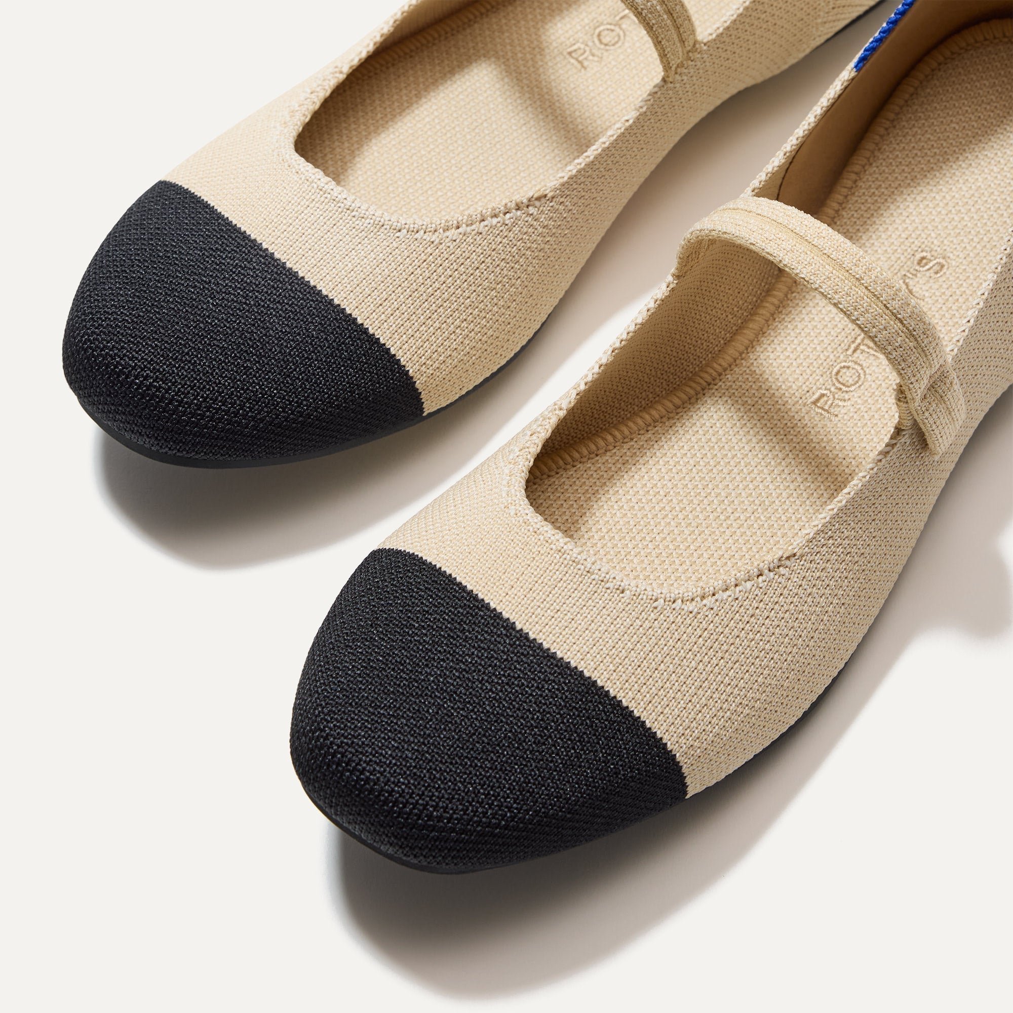 Top view of the square toe and rounded vamp of The Square Mary Jane in Cream Captoe. 