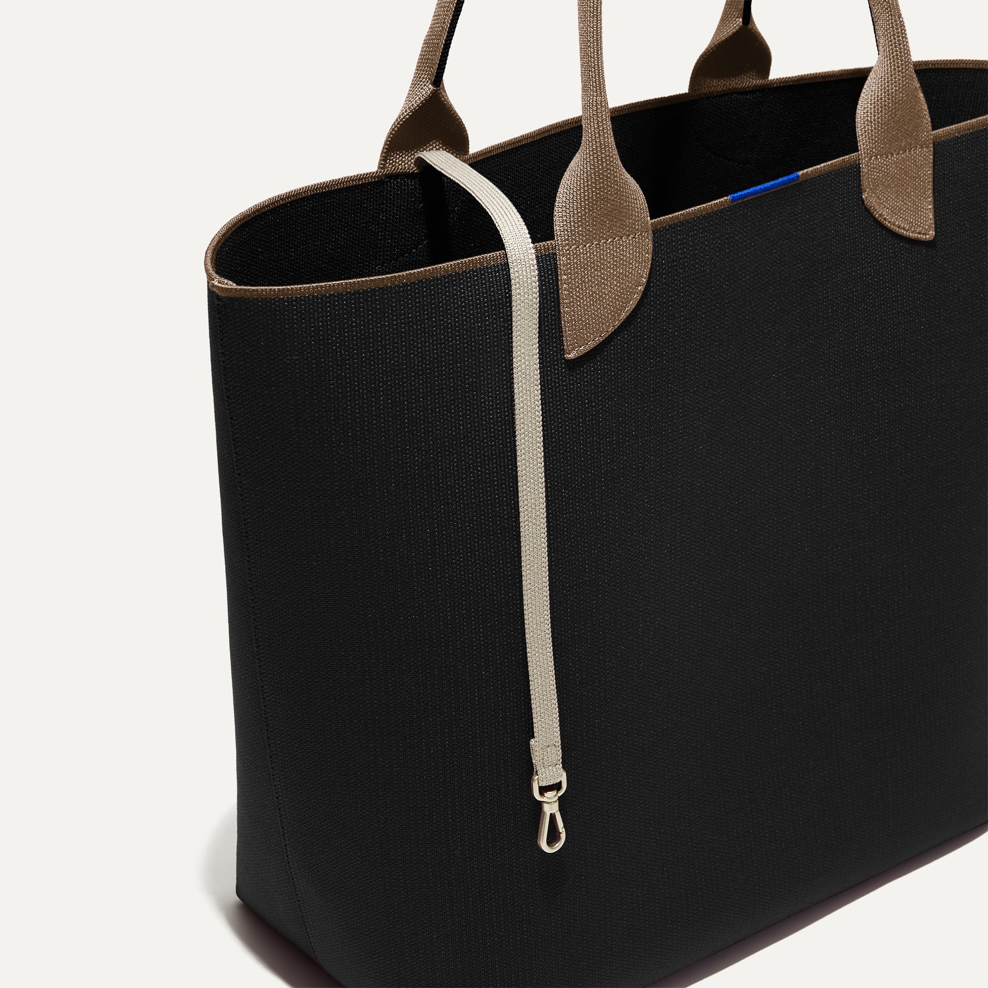 The Lightweight Tote in Black Portobello shown with its handy key leash.