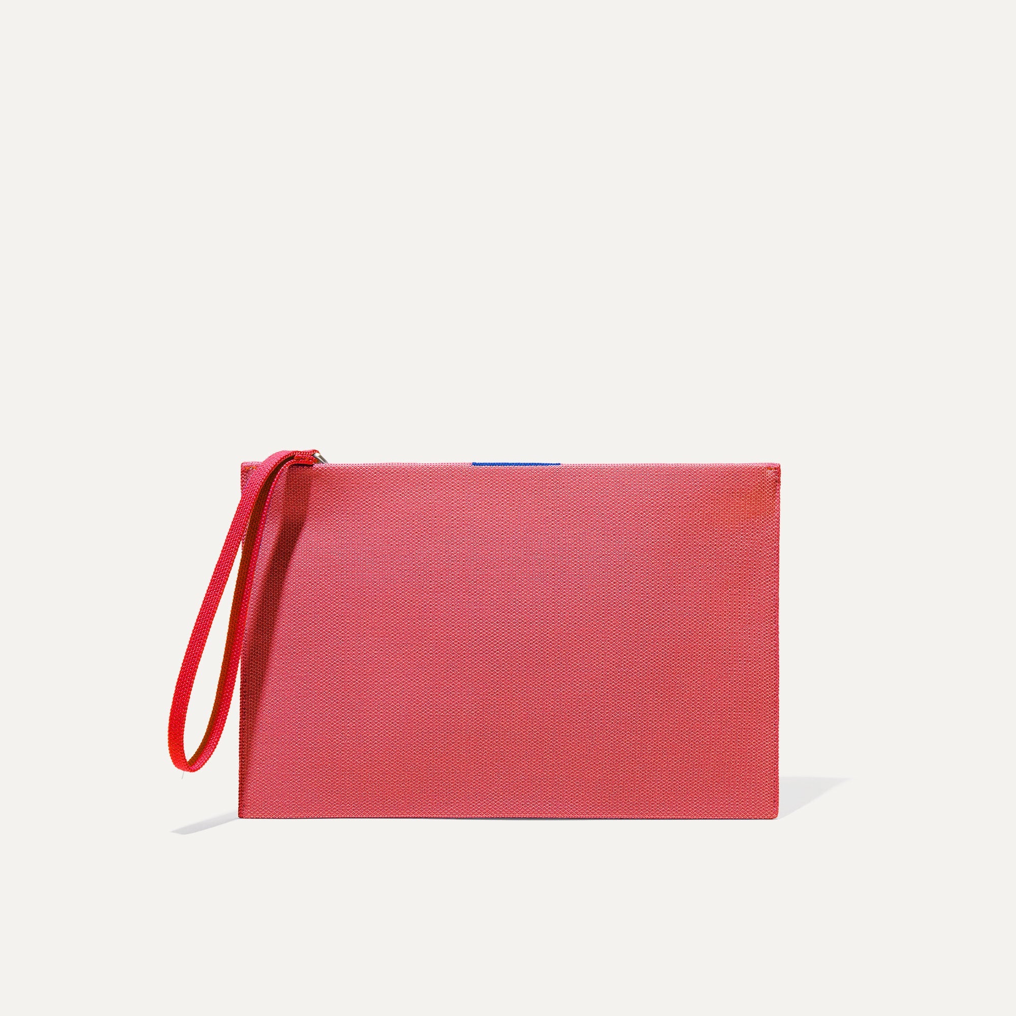 PLP |The Wristlet in Ruby Grapefruit shown from the front.
