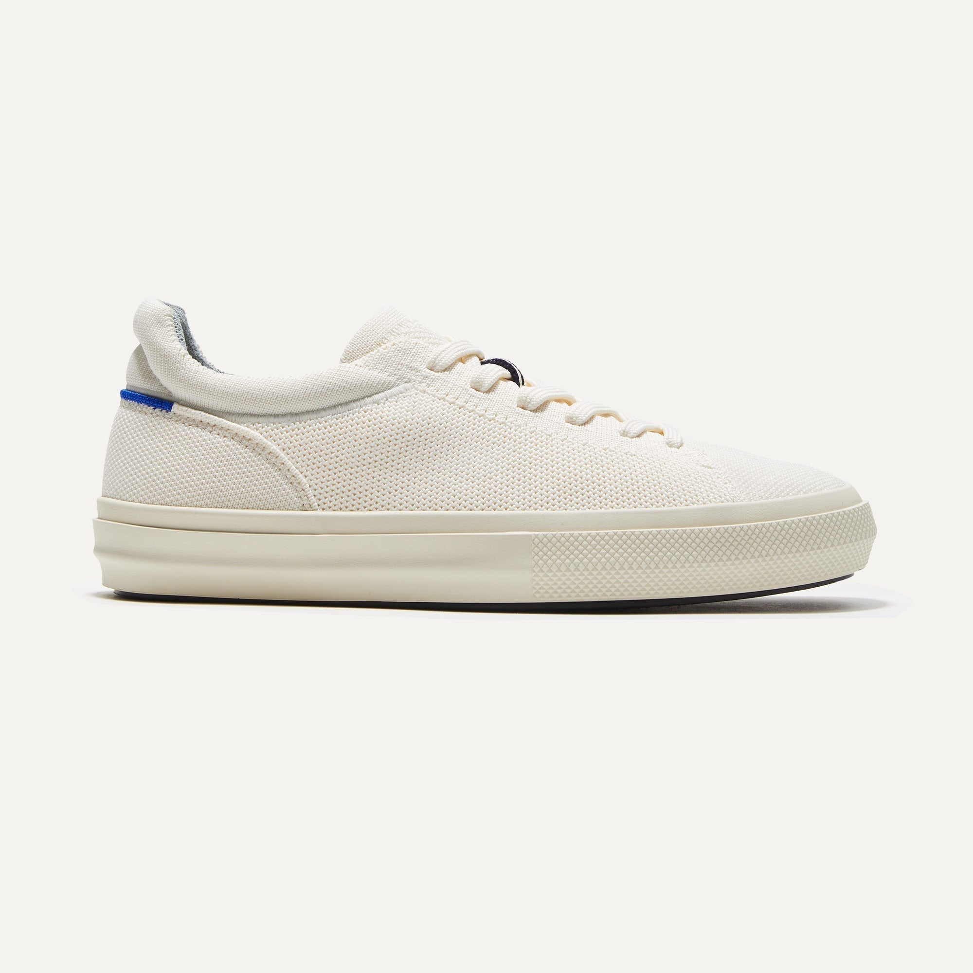 The RS02 Sneaker in Bone shown from the side.