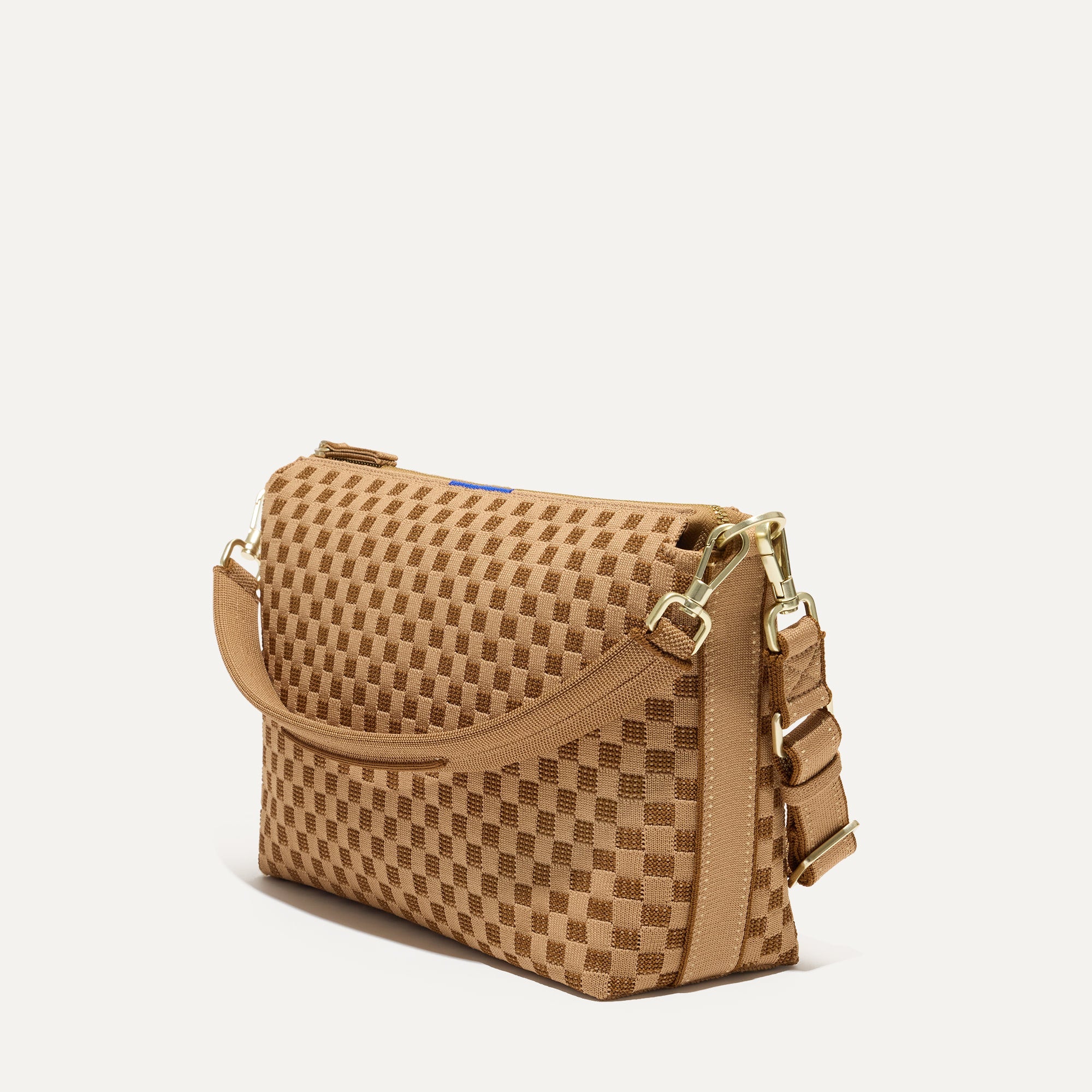 The Daily Crossbody Bag in Hazelnut shown at a diagonal view from the left.