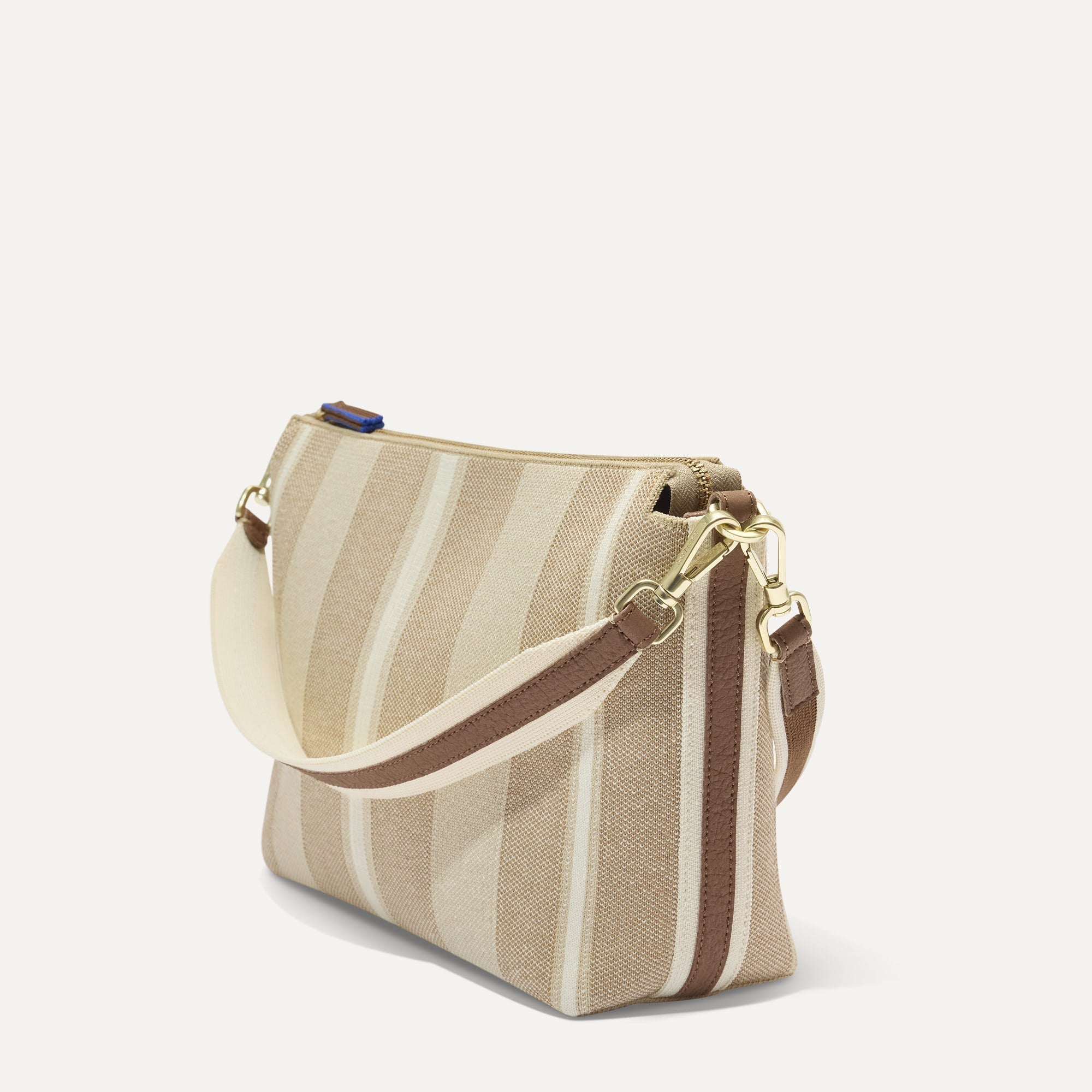 The Daily Crossbody in Oat Latte, shown at a diagonal view from the left.