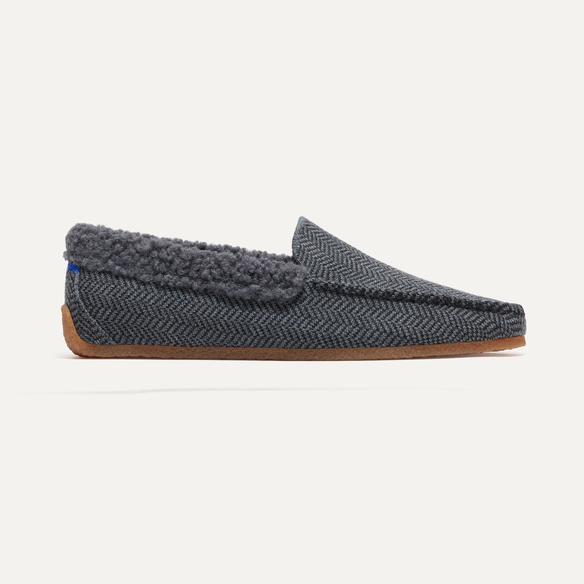 The Men's Slipper in Charcoal Herringbone shown from the side. 