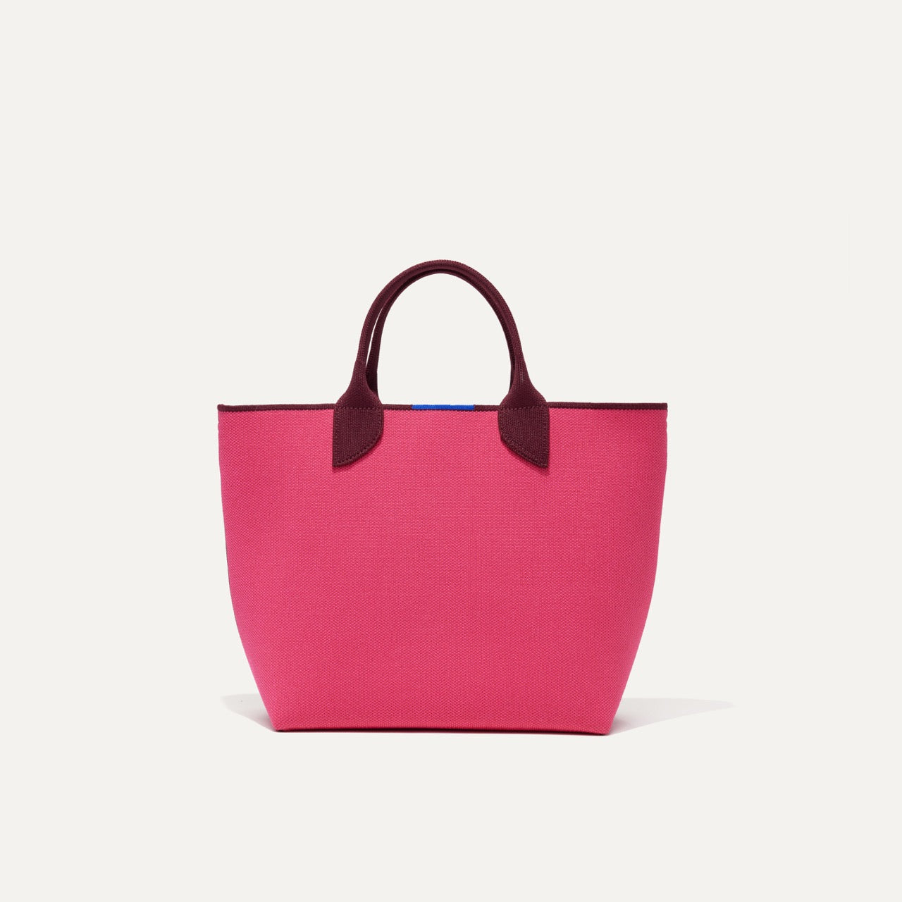PLP |The Lightweight Petite Tote in Perfect Pink, shown from the front.