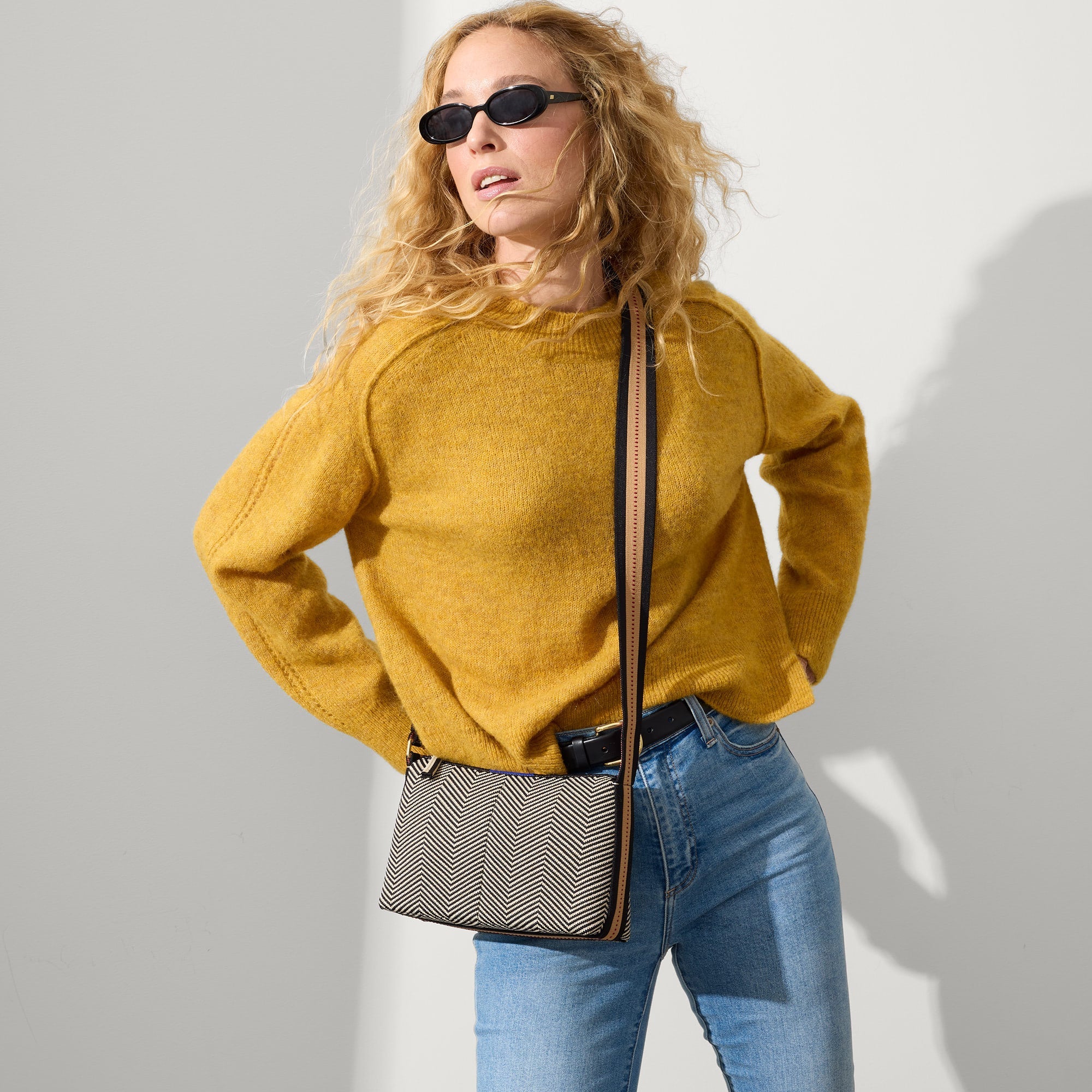 hover | The Casual Crossbody in Dark Mist, worn as a crossbody by a model, shown from the front. 
