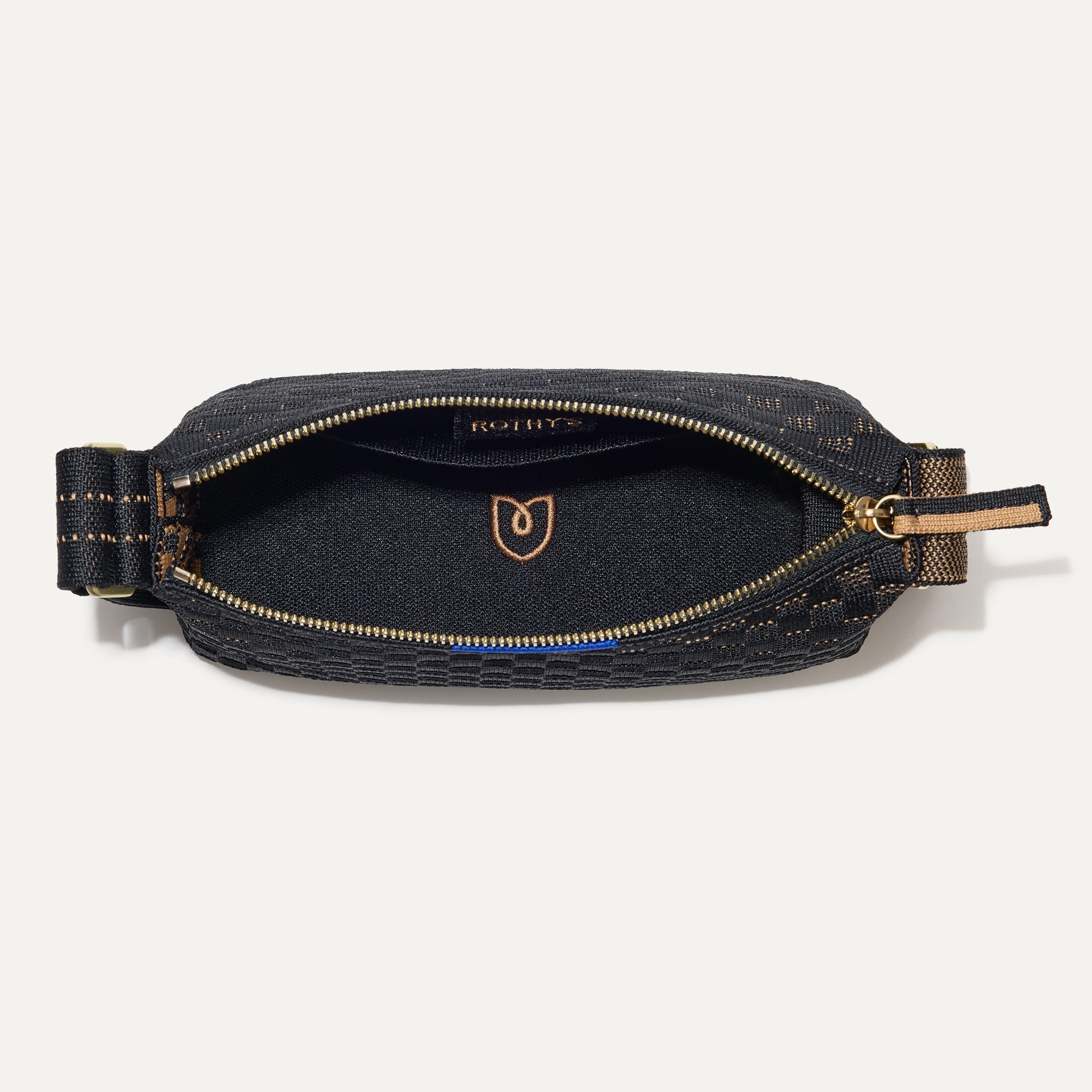The Casual Crossbody in Night Song, shown from above, with the interior exposed. 