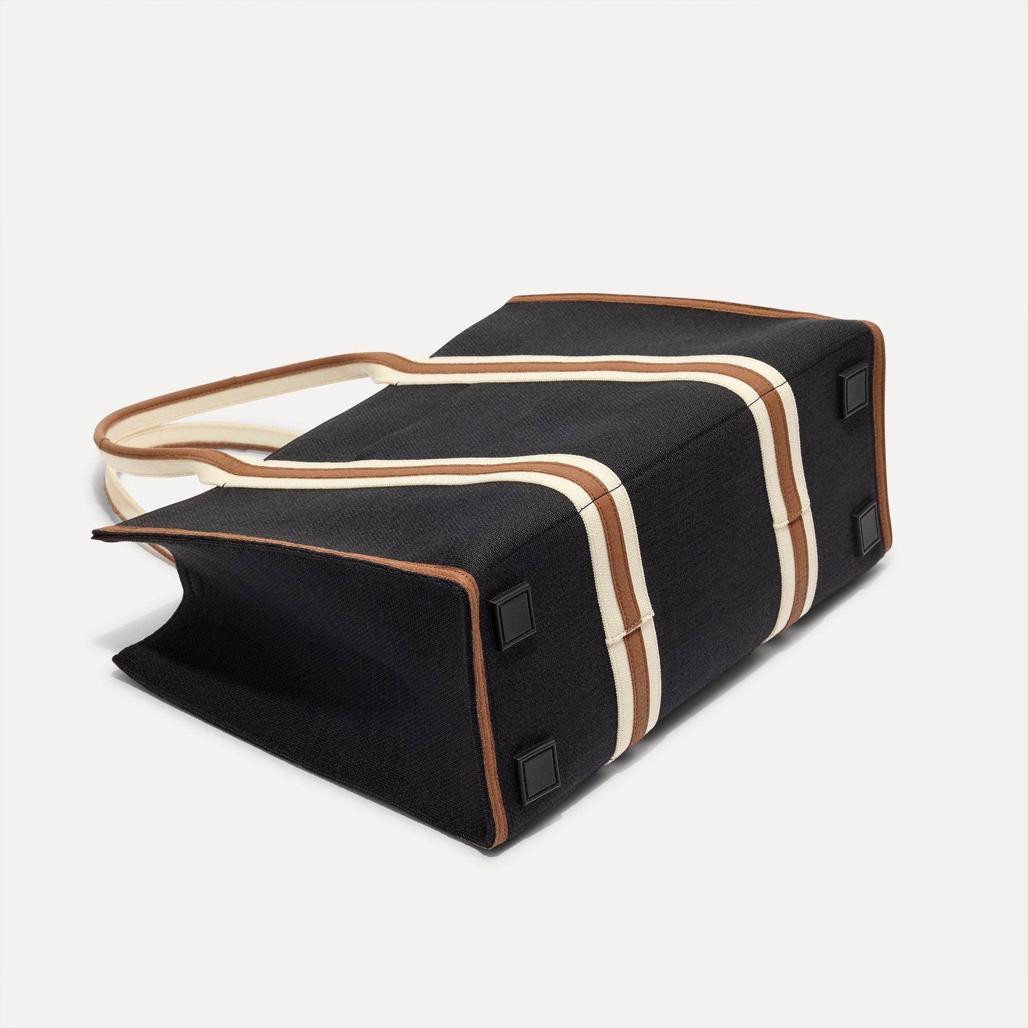 The Classic Tote in Black Coffee, shown from the bottom.