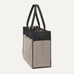 The Classic Tote in Black Herringbone, shown from the side.