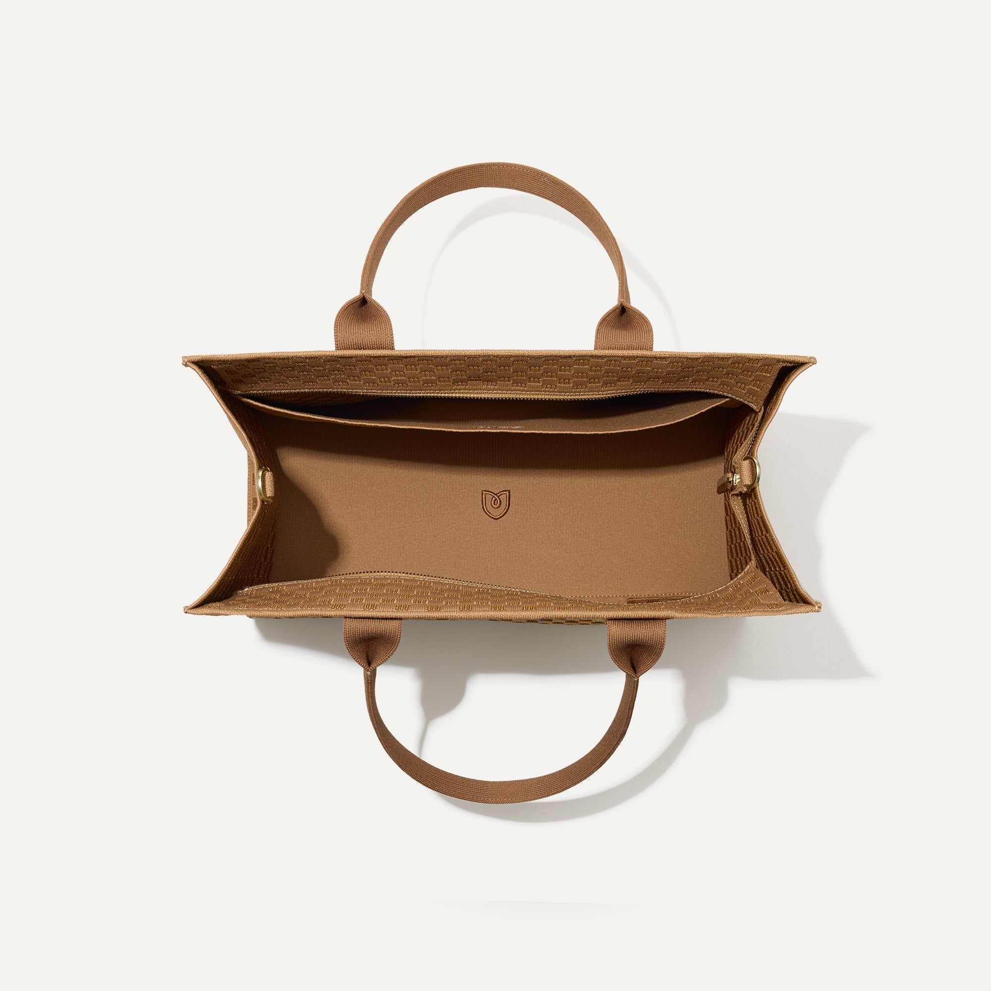 The Classic Tote in Hazelnut, shown from above, with the interior exposed.