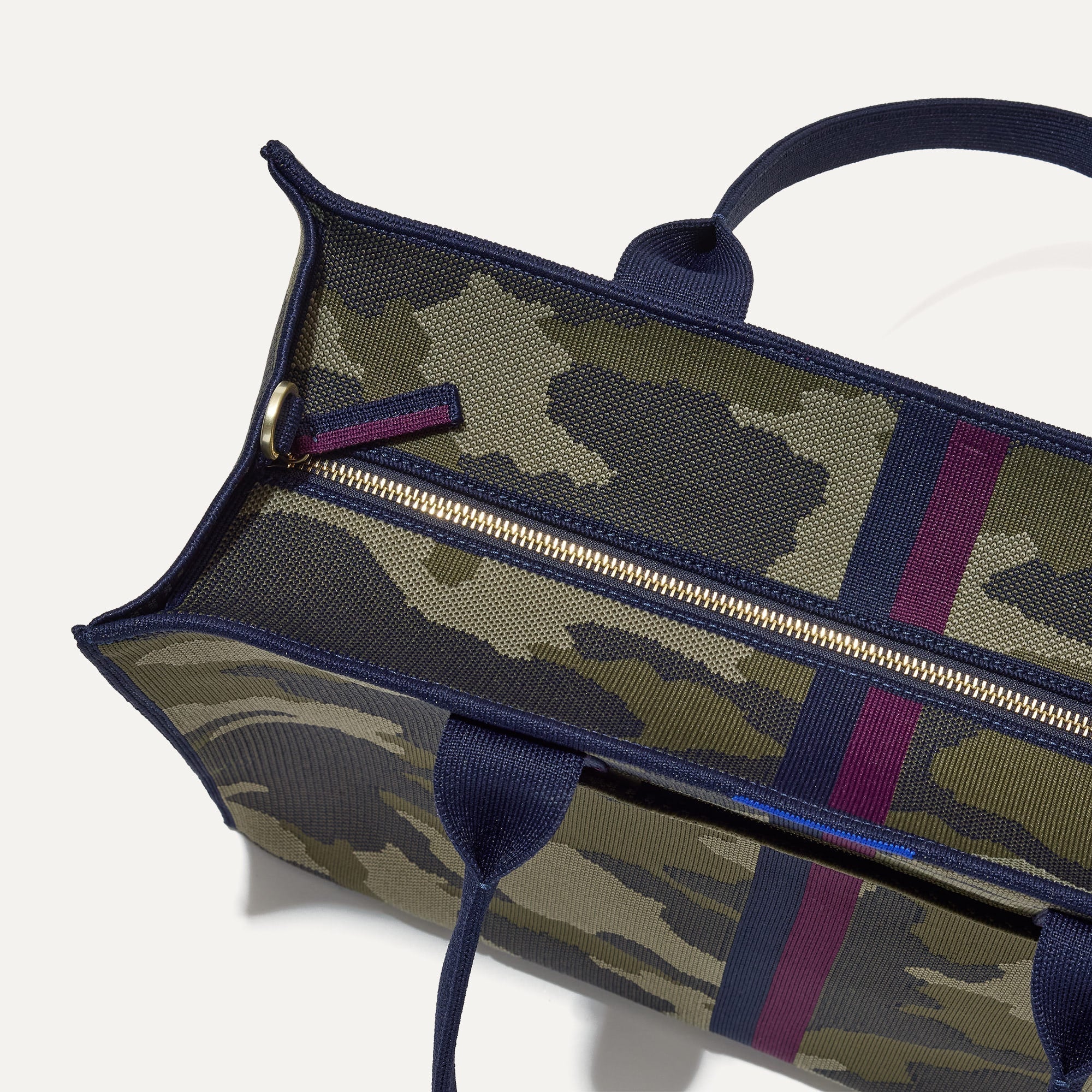 The Classic Tote in Spruce Camo, shown from above, with the top zipper closed. 