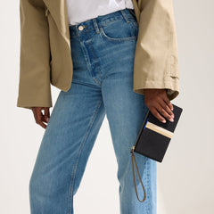 hover | The Wallet Wristlet in Black Portobello Stripe, shown packed into The Lighweight Petite Tote by a model.