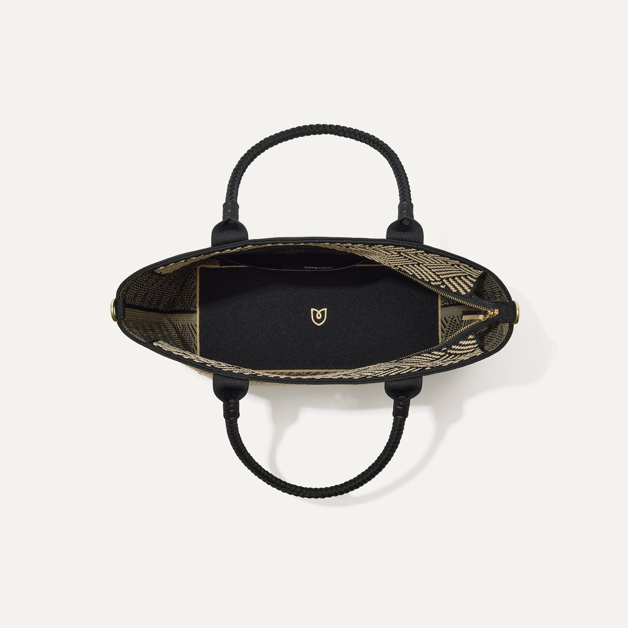 The Lightweight Zip Tote in Polar Zig Zag, shown from above with the interior exposed.