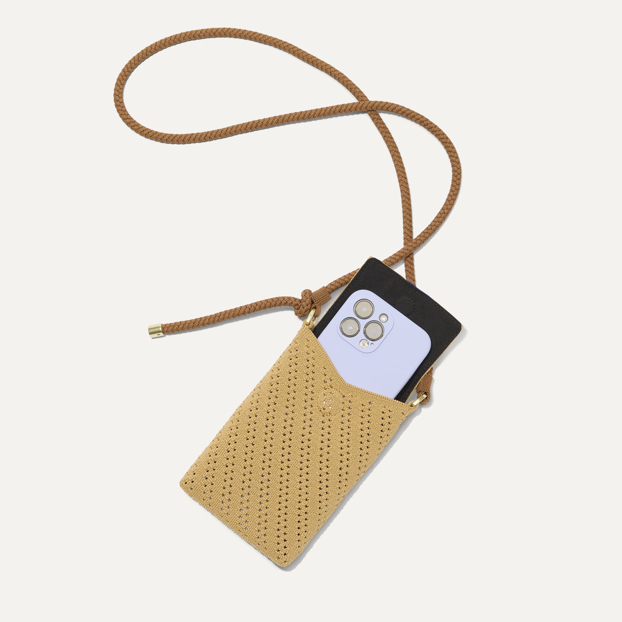 The Phone Crossbody in Brown Butter Crochet shown from above with an iPhone inside.