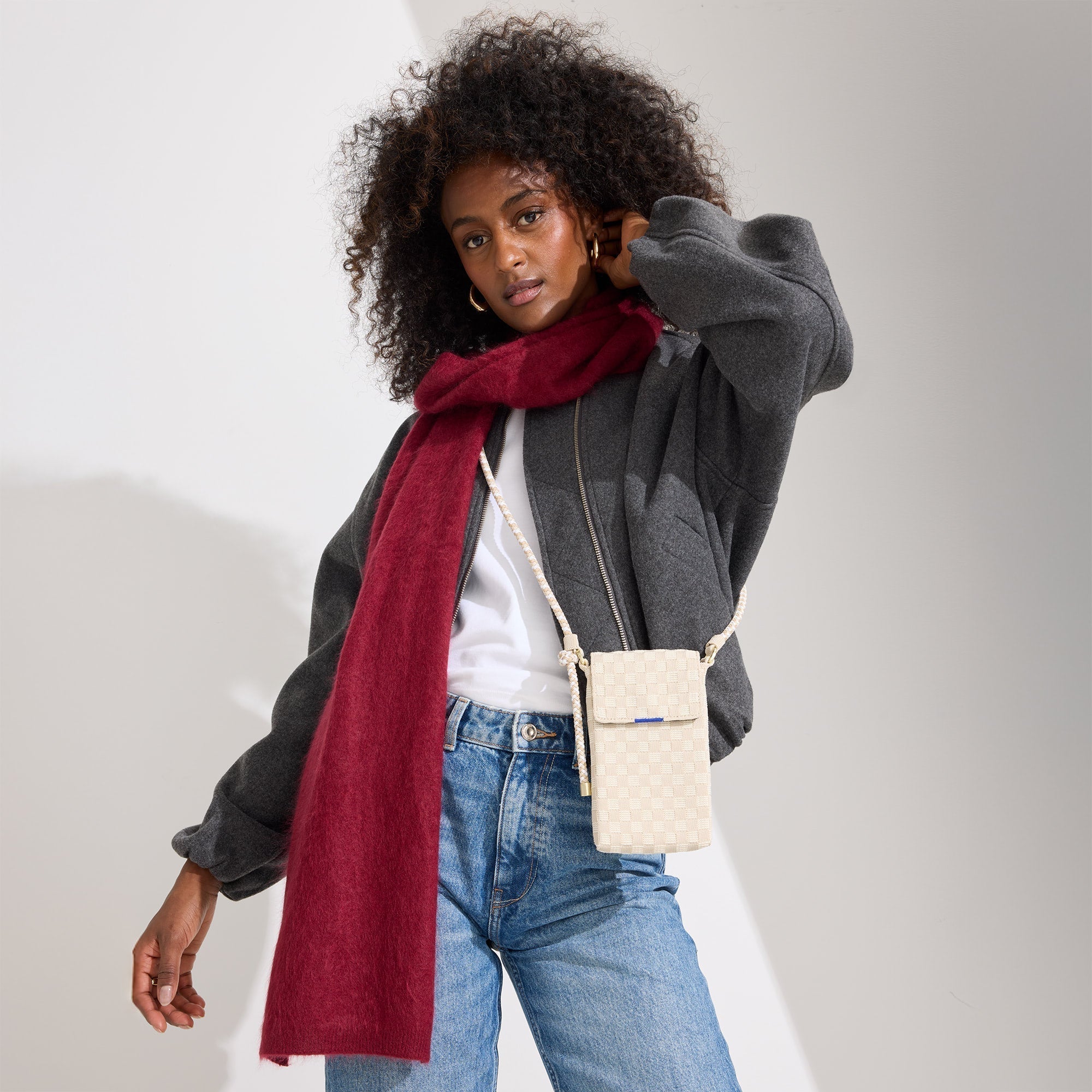 hover | Model wearing The Phone Crossbody in White Sand.