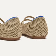 Close up of the heel of The Double Buckle Mary Jane in Dune Mesh, with Rothy's signature blue halo.