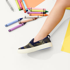 hover | Model wearing The Kids Sneaker in Spruce Camo.