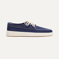 The Ravello Boat Shoe in Nautical Navy shown from the side. 