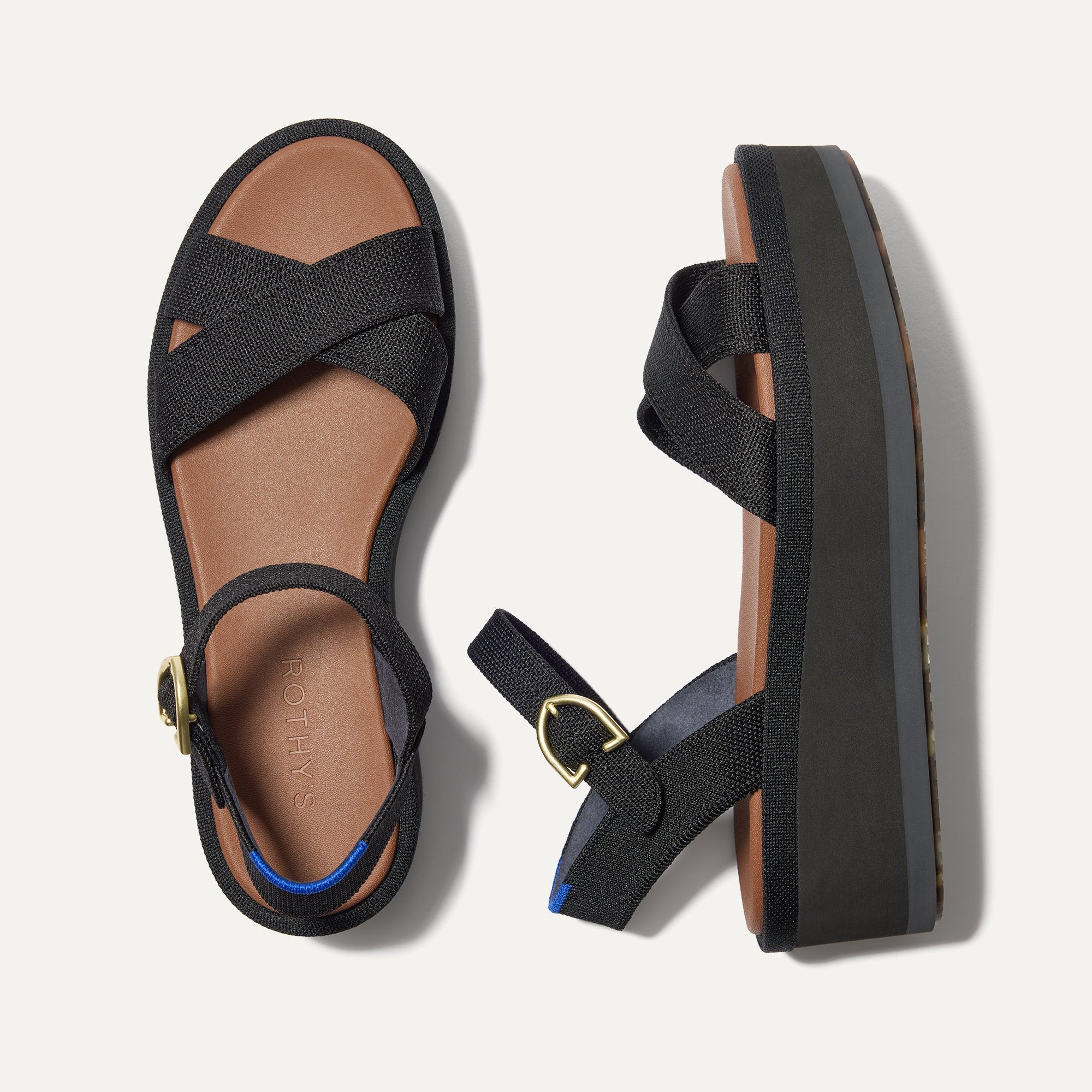The Criss-Cross Lightweight Wedge Sandal in Black shown from the top.