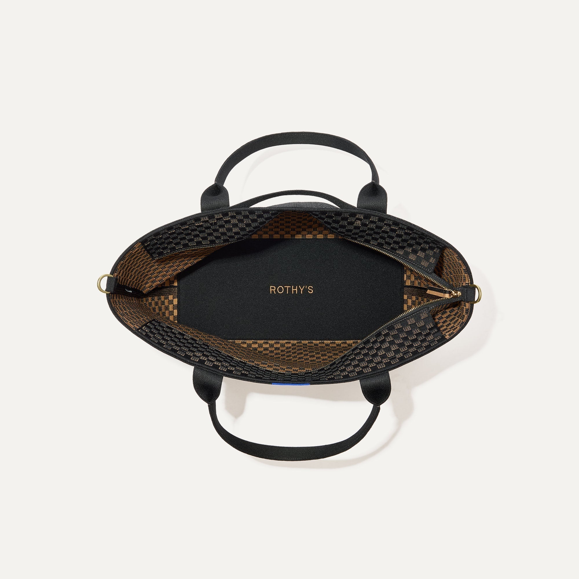 The Zip Travel Tote, shown from above with the interior exposed.