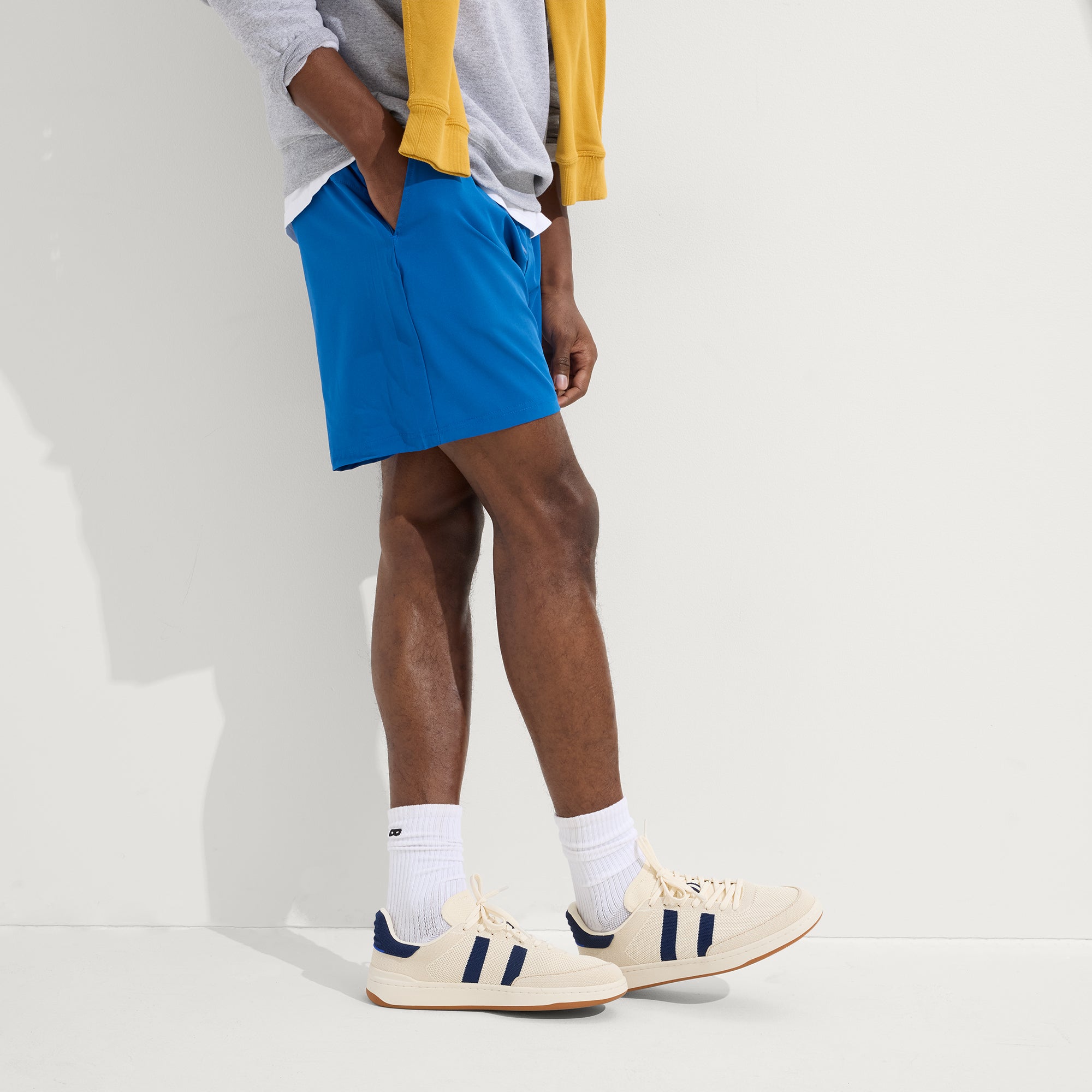 hover | Model wearing The Men's Court Sneaker in Freestyle. 