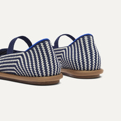 Close up of the heel of The Cruiser Mary Jane in Blackberry Stripe, with Rothy's signature blue halo. 