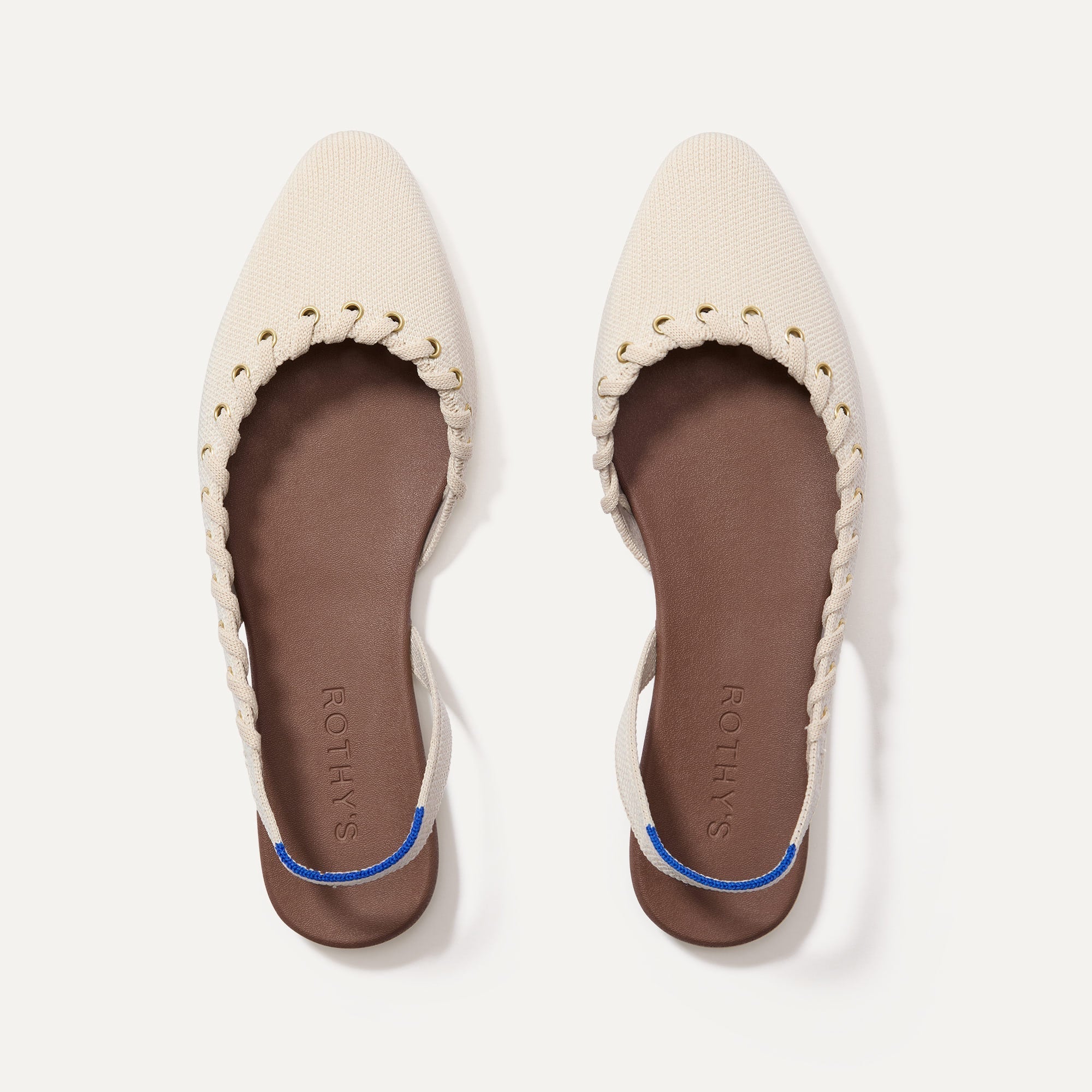 The Almond Slingback in Eyelet Ivory shown from the top.