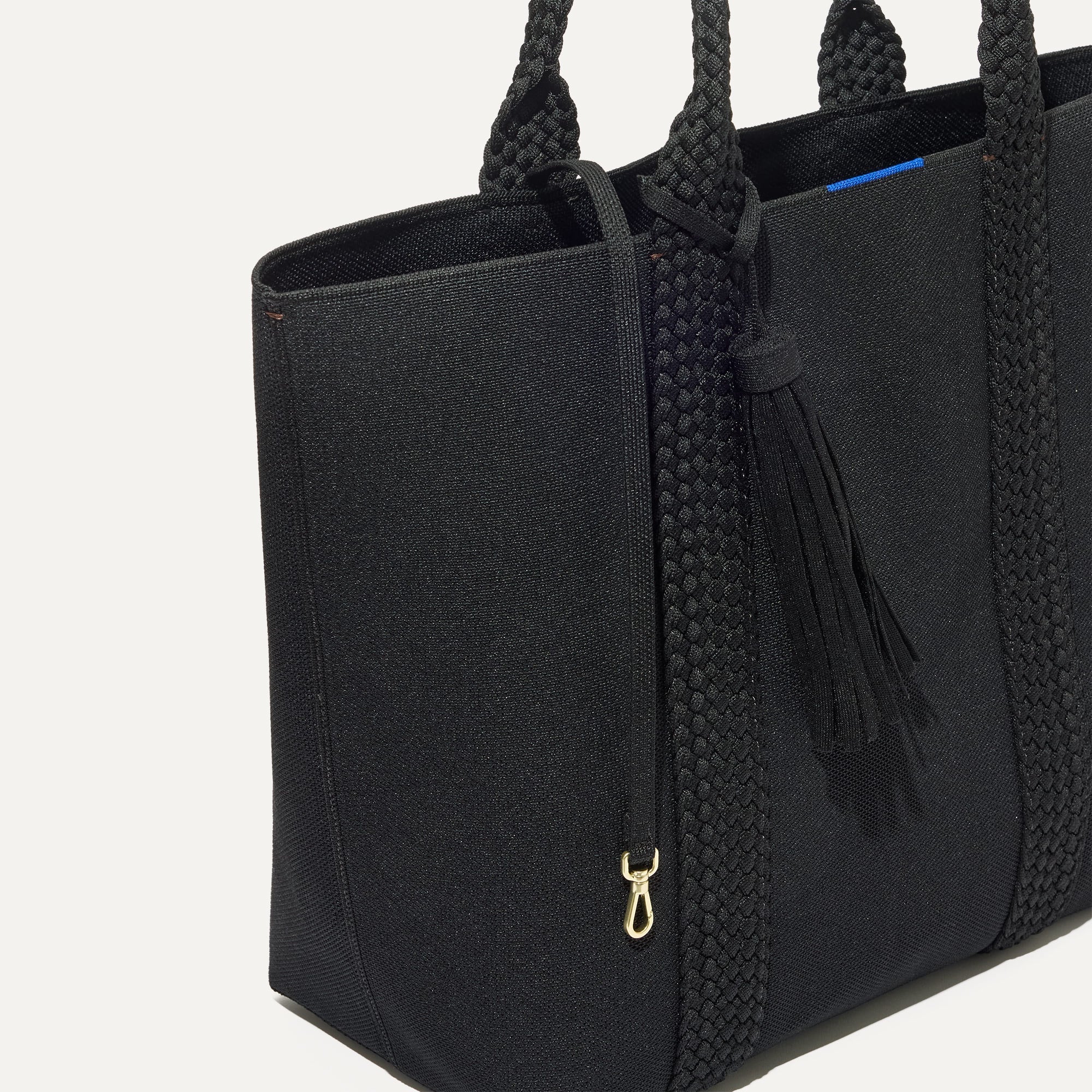 The Lighweight Tote in Black Licorice shown with its handy key leash.