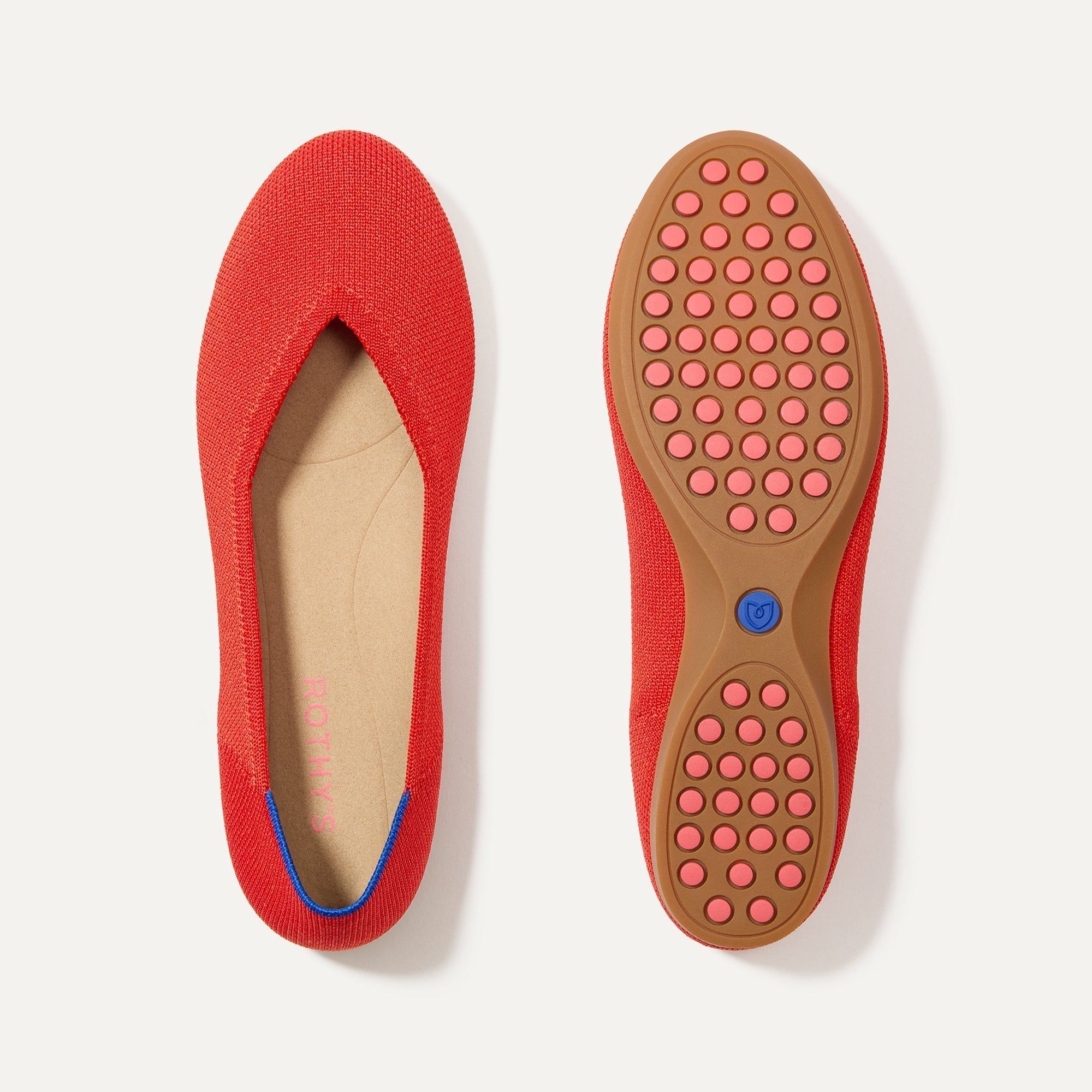 PLP |The Daily Flat in Showstopper Red shown from the top with one shoe showing the outsole. 