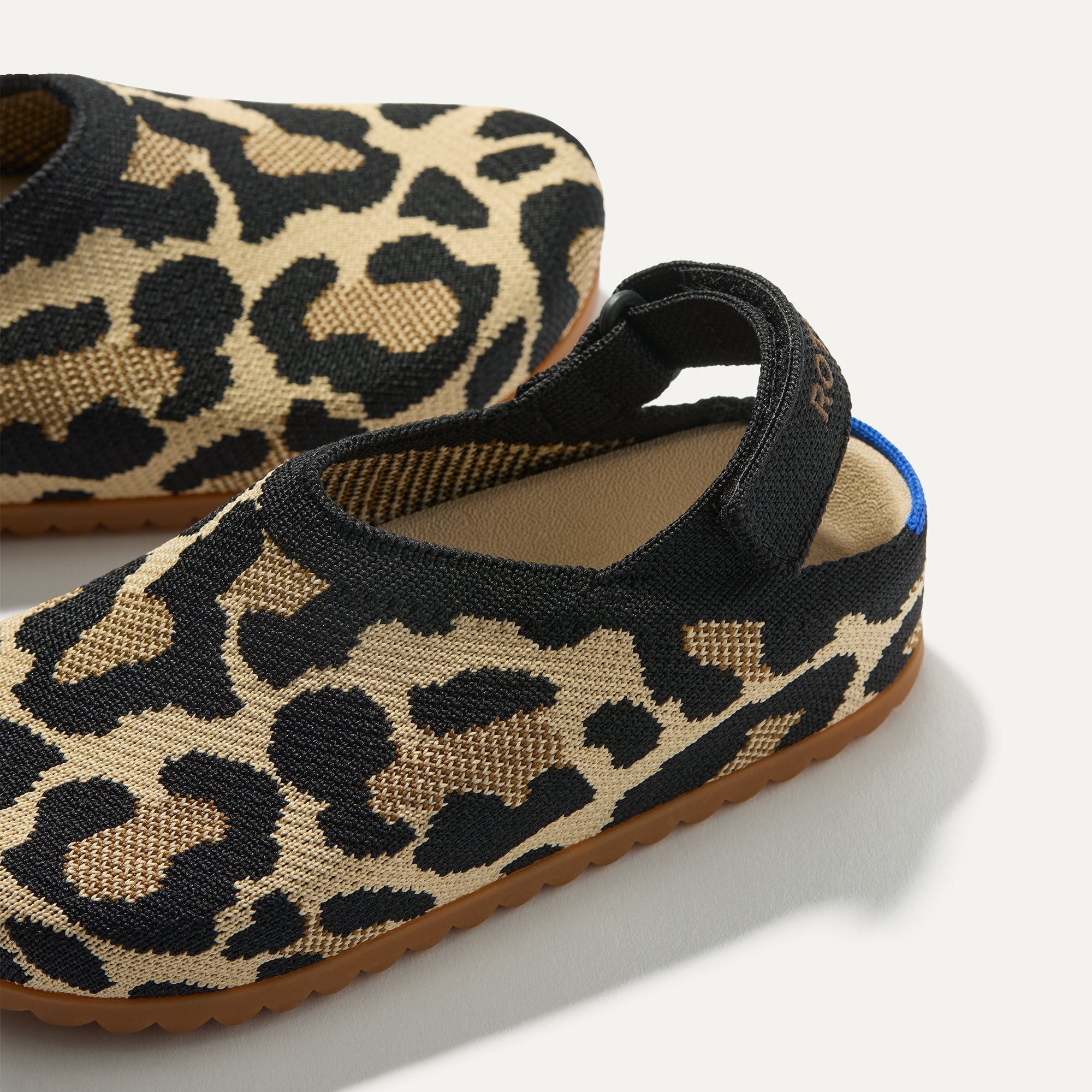 Close up of the rounded topline of The Kids Clog in Desert Cat. 