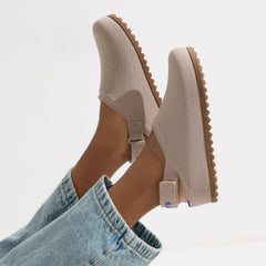 hover | A child wearing The Kids Clog in Dove. 